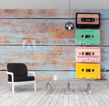 Bild på Top view above shot of retro tape cassette on wood table - vintage pastel color effect styles